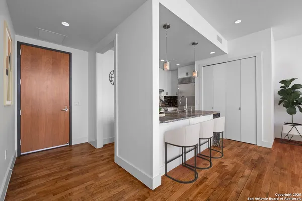 a view of kitchen with furniture and wooden floor