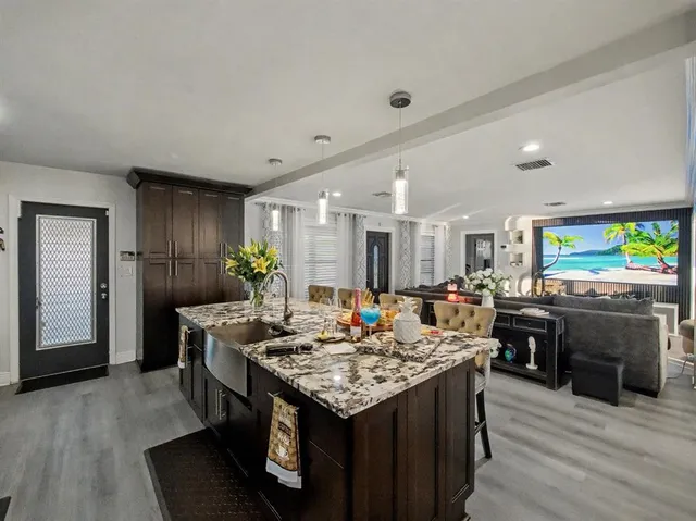 a kitchen with a table and chairs in it