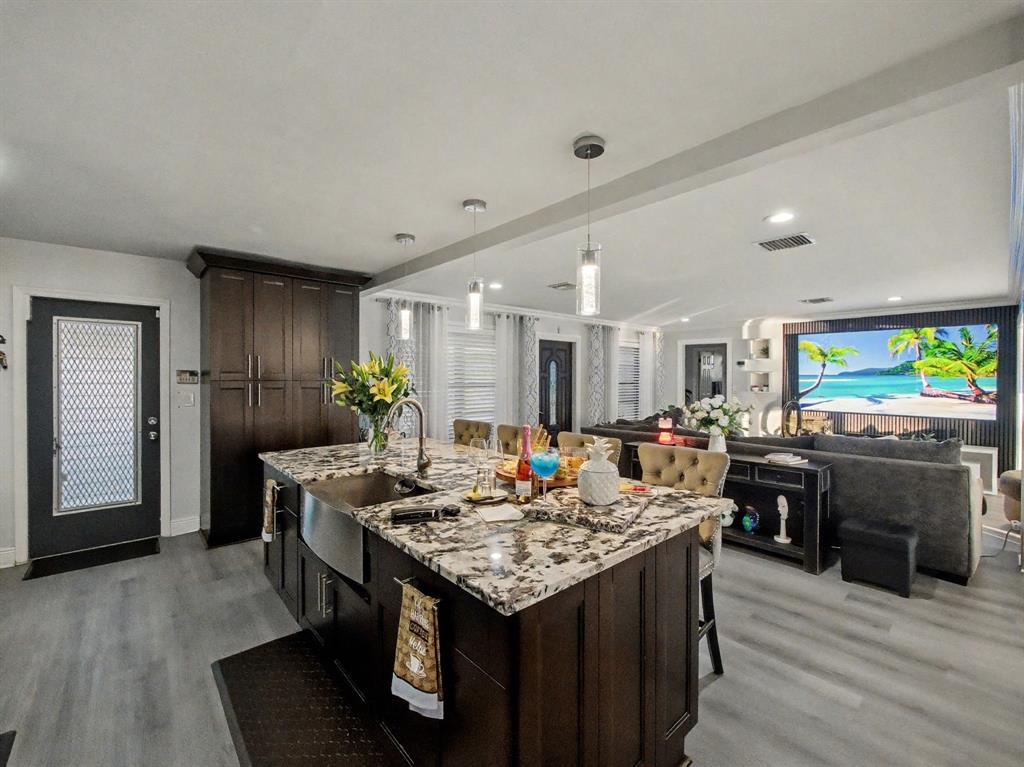 1255 Northwest 63rd Way Margate, FL 33063 - Photo 13 of 33 a kitchen with a table and chairs in it