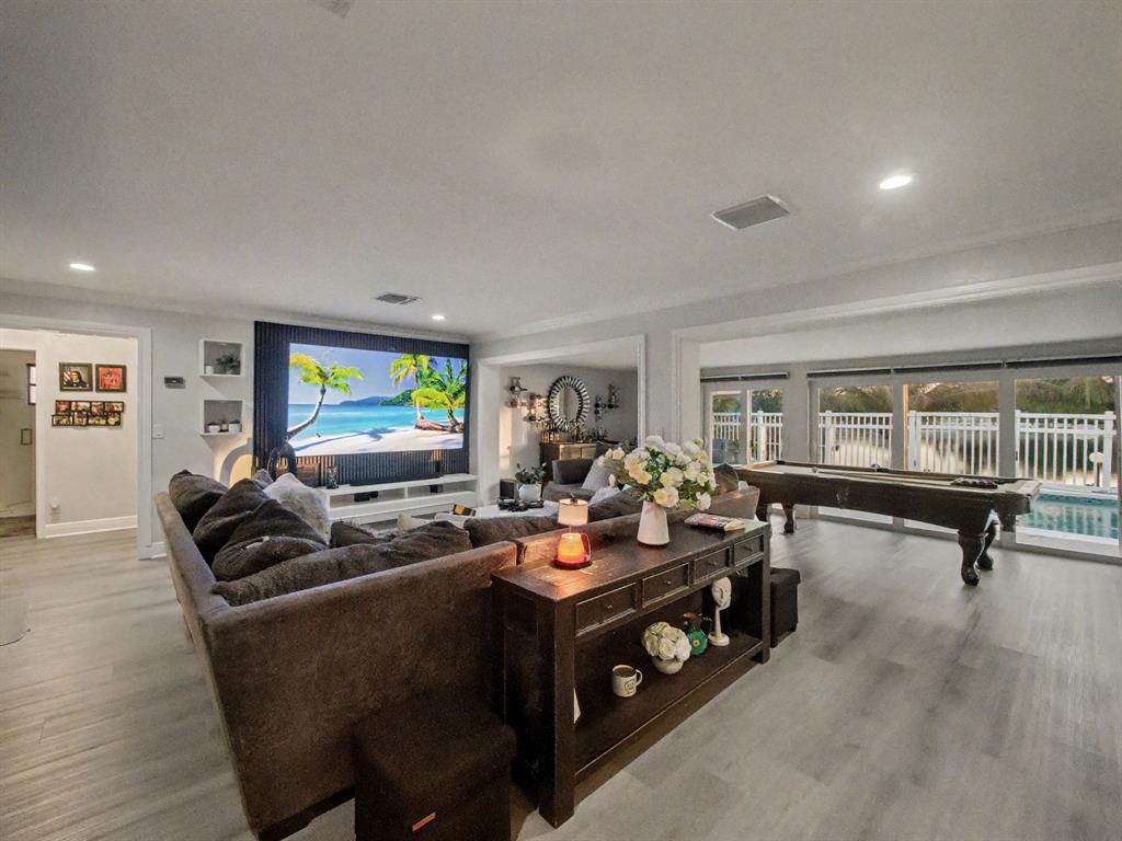 1255 Northwest 63rd Way Margate, FL 33063 - Photo 14 of 33 a living room with furniture and a flat screen tv