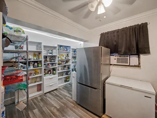 a kitchen with stainless steel appliances a refrigerator a stove a sink and a counter