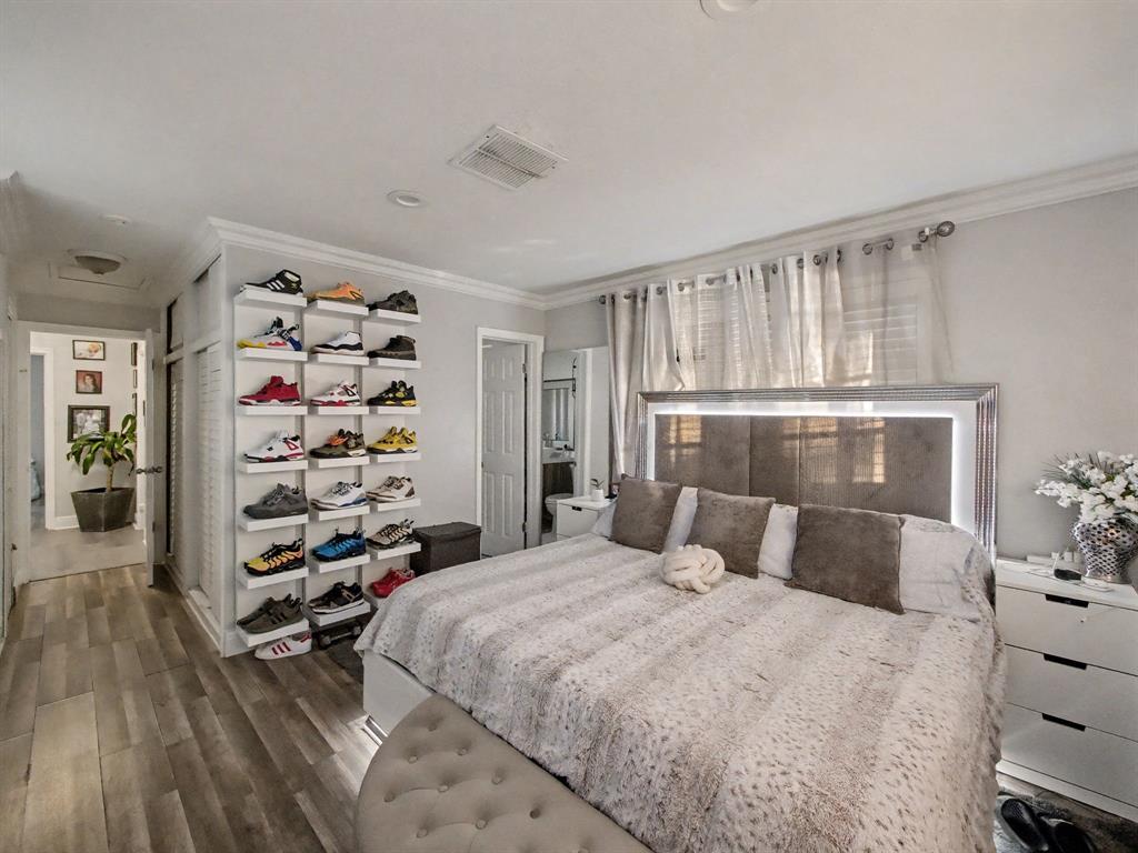 1255 Northwest 63rd Way Margate, FL 33063 - Photo 19 of 33 a bedroom with a large bed and a window