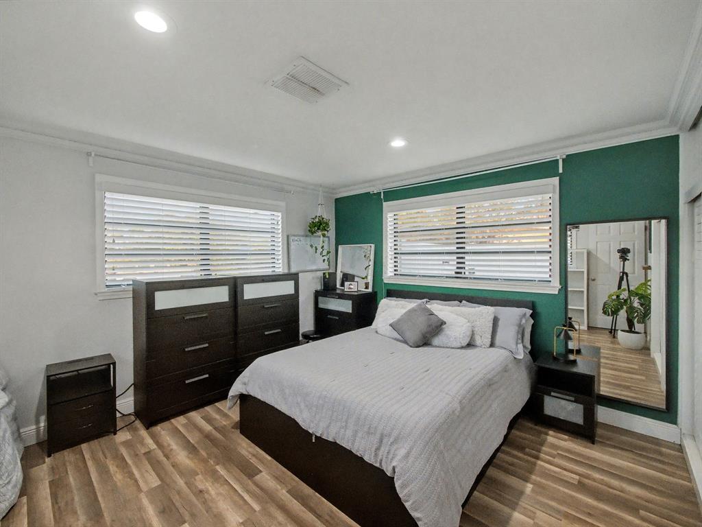 1255 Northwest 63rd Way Margate, FL 33063 - Photo 20 of 33 a bedroom with a bed and a dresser