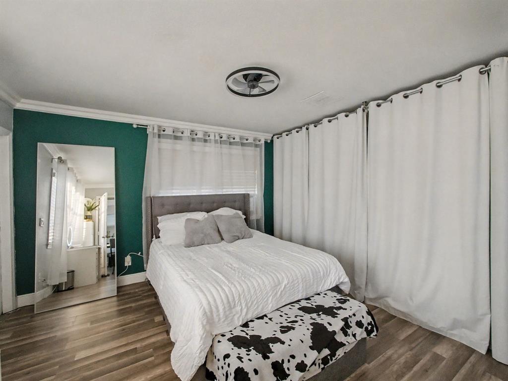 1255 Northwest 63rd Way Margate, FL 33063 - Photo 21 of 33 a bedroom with a bed and a window