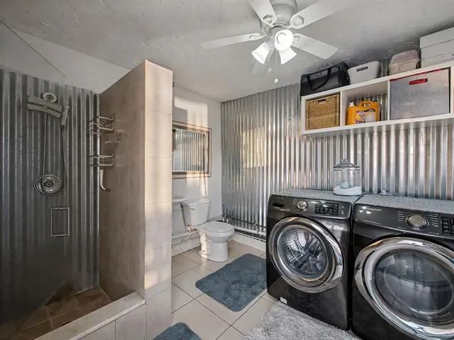 a view of a hallway with washer and dryer