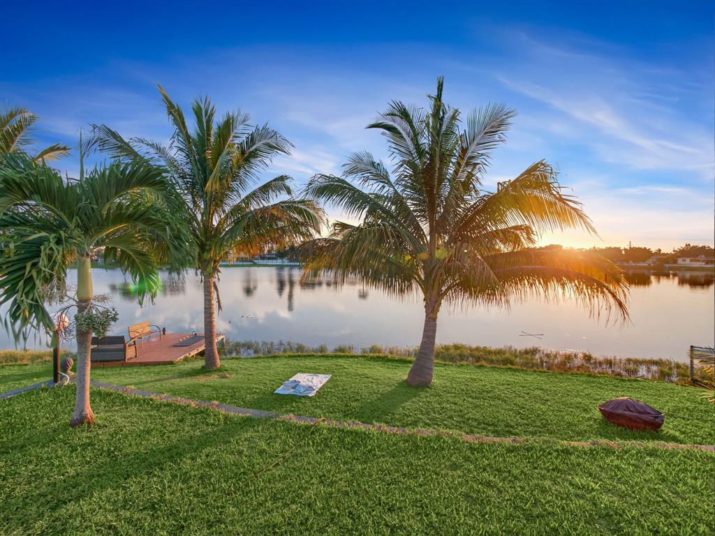 1255 Northwest 63rd Way Margate, FL 33063 - Photo 28 of 33 a view of a yard with palm trees
