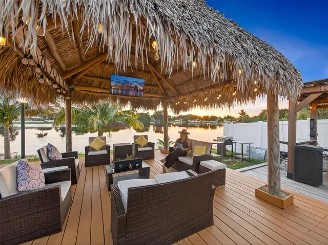 a view of a patio with couches and pool