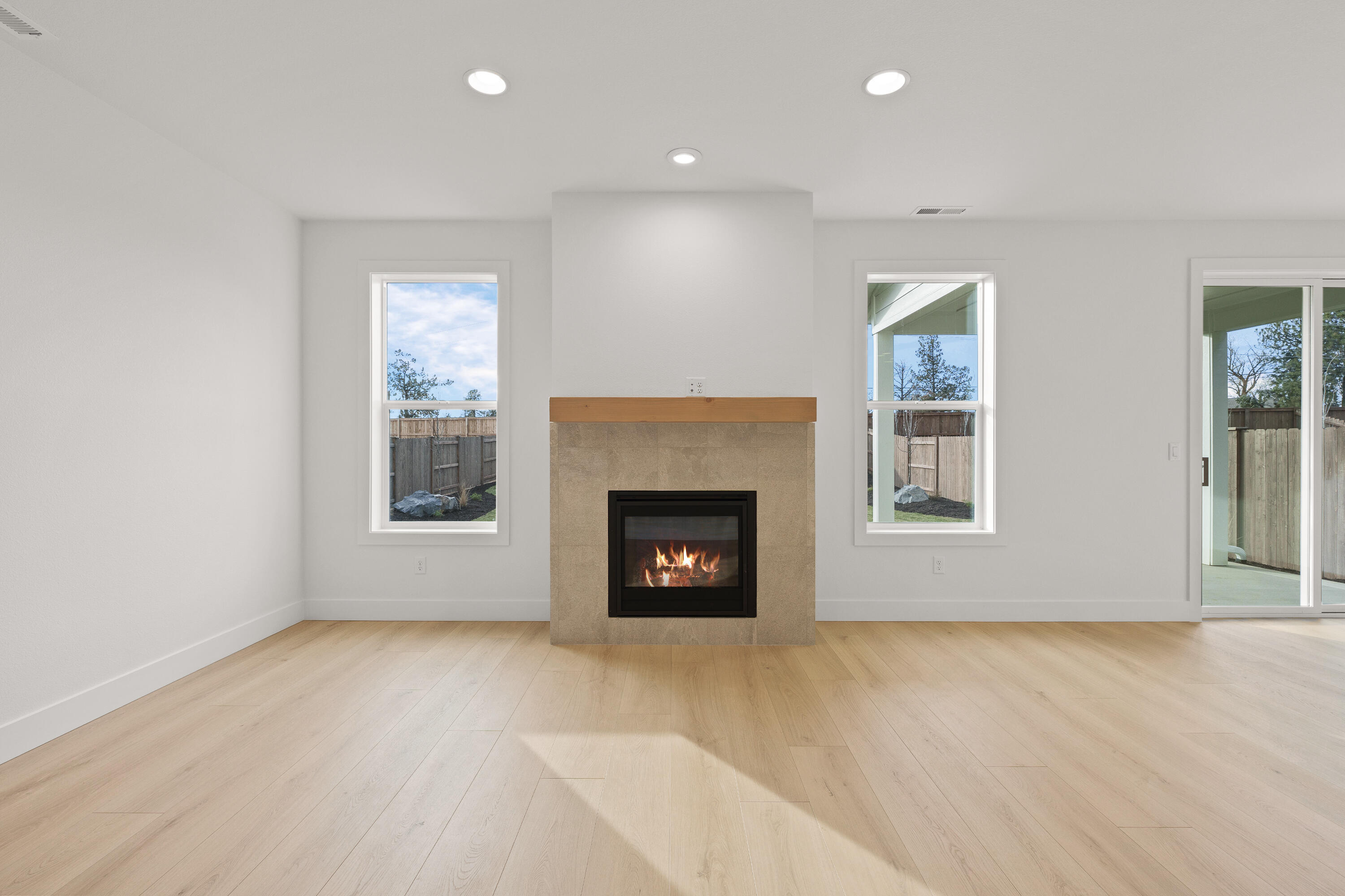 4383 Southwest Rhyolite Place, Unit 22 Redmond, OR 97756 - Photo 12 of 44 a view of an empty room with a window and fireplace