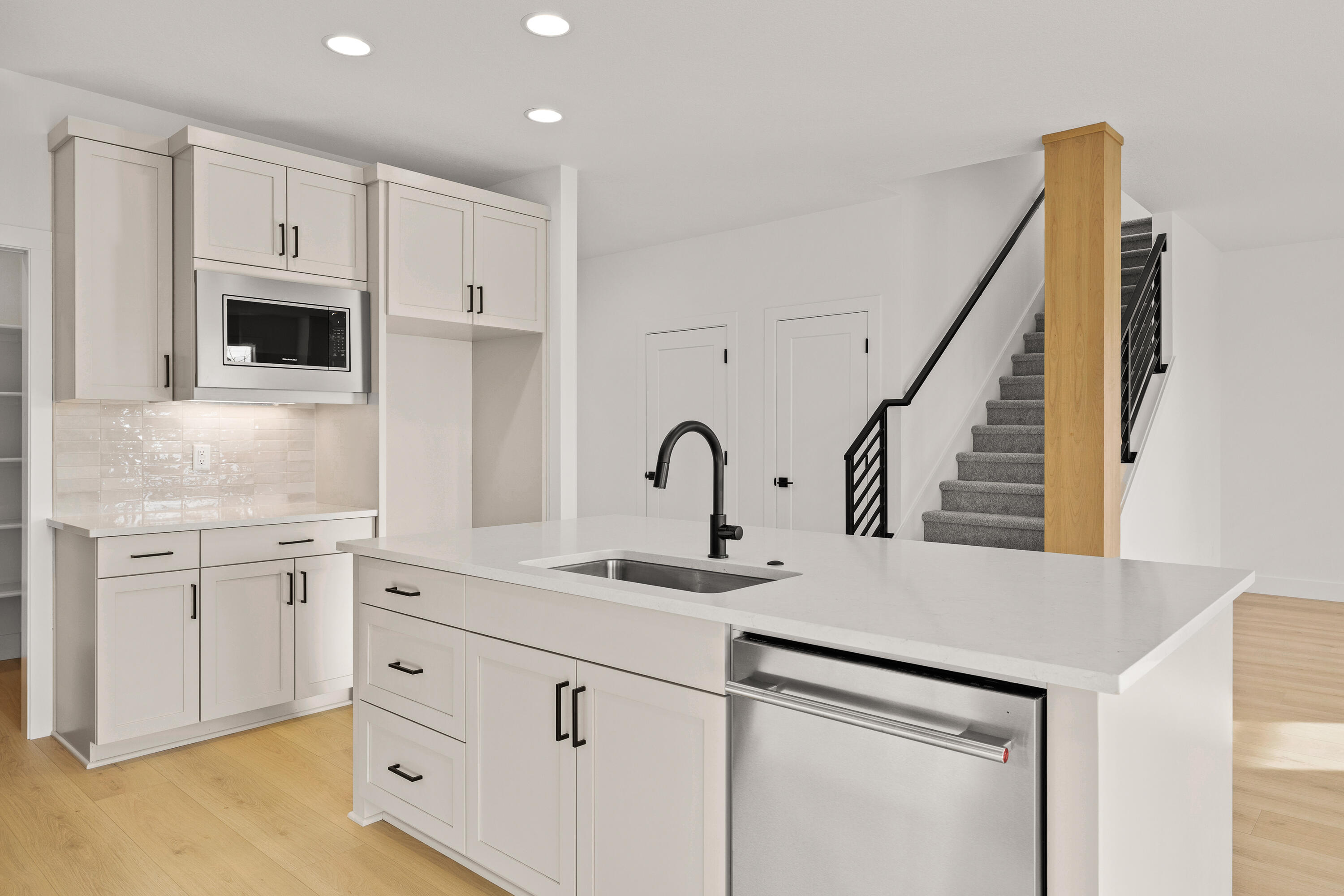4383 Southwest Rhyolite Place, Unit 22 Redmond, OR 97756 - Photo 17 of 44 a kitchen with white cabinets appliances and sink