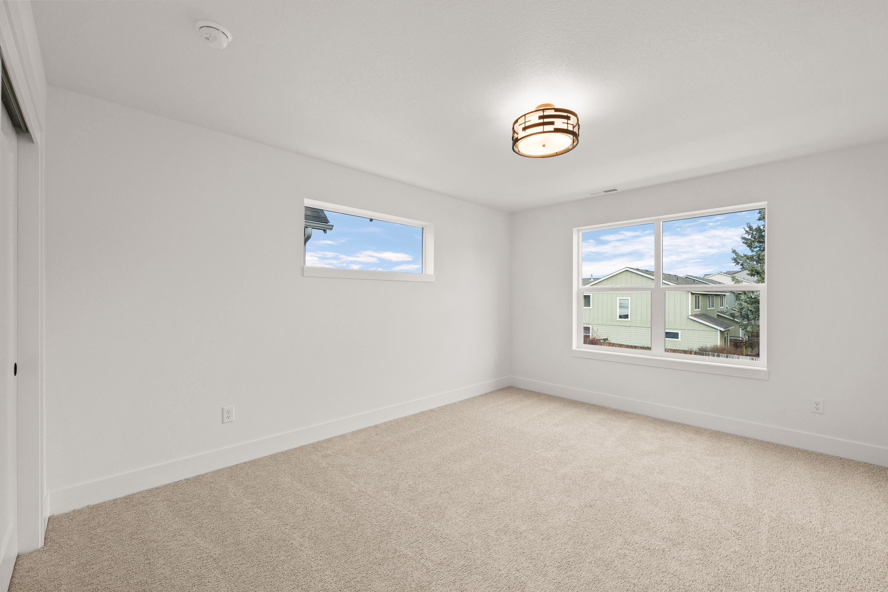 4383 Southwest Rhyolite Place, Unit 22 Redmond, OR 97756 - Photo 28 of 44 an empty room with a window