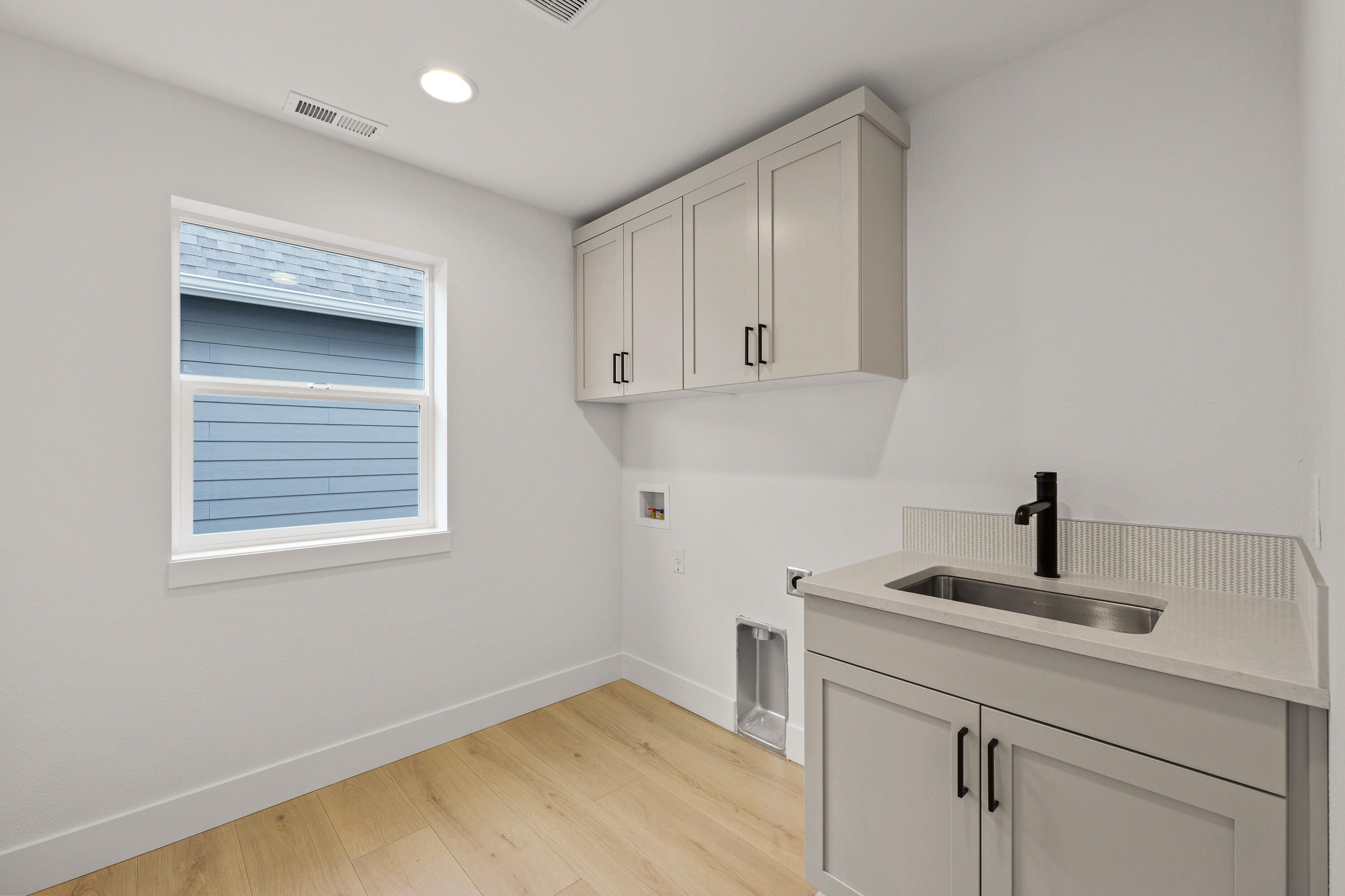 4383 Southwest Rhyolite Place, Unit 22 Redmond, OR 97756 - Photo 29 of 44 a kitchen with a sink cabinets and a window