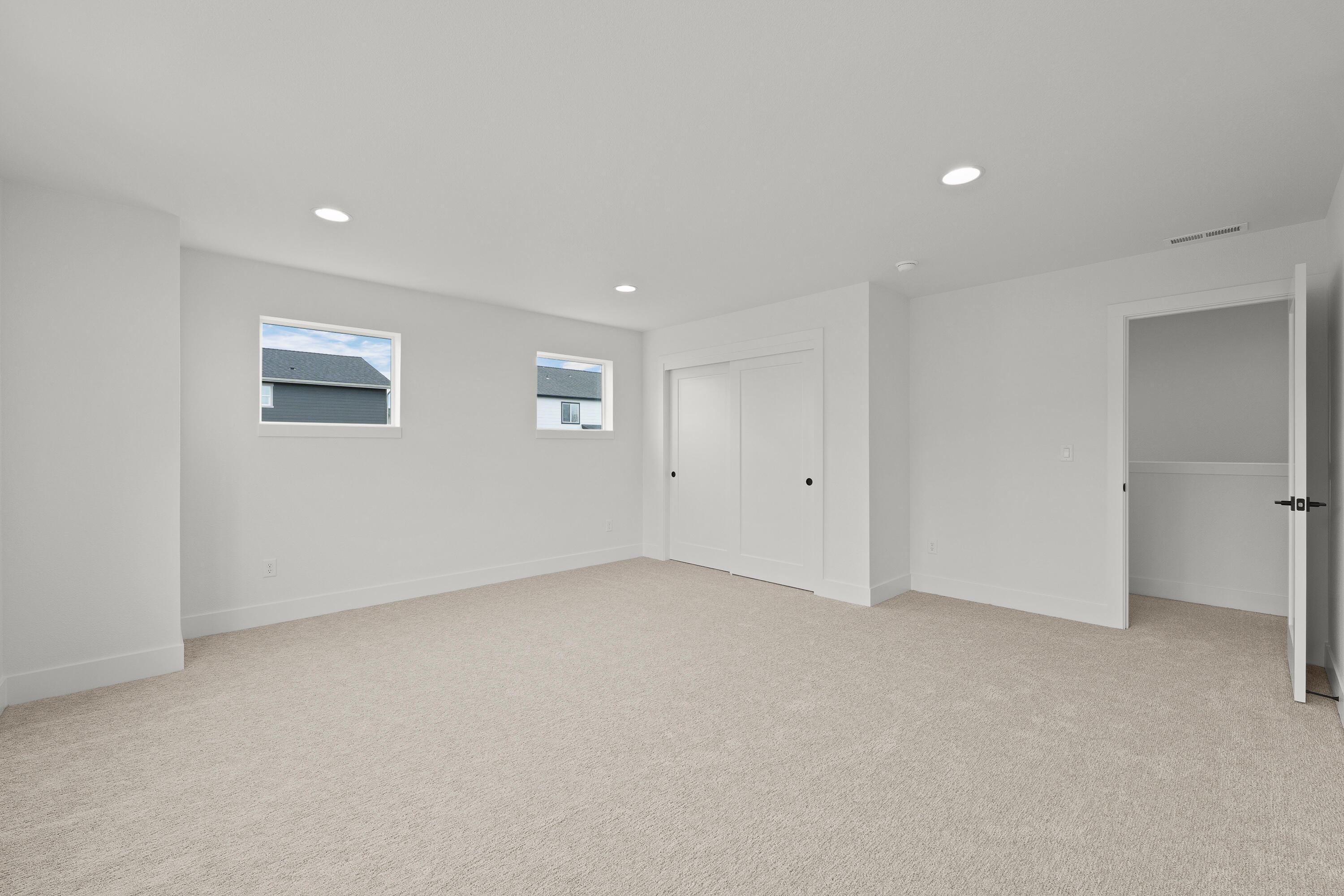 4383 Southwest Rhyolite Place, Unit 22 Redmond, OR 97756 - Photo 32 of 44 an empty room with windows and closet