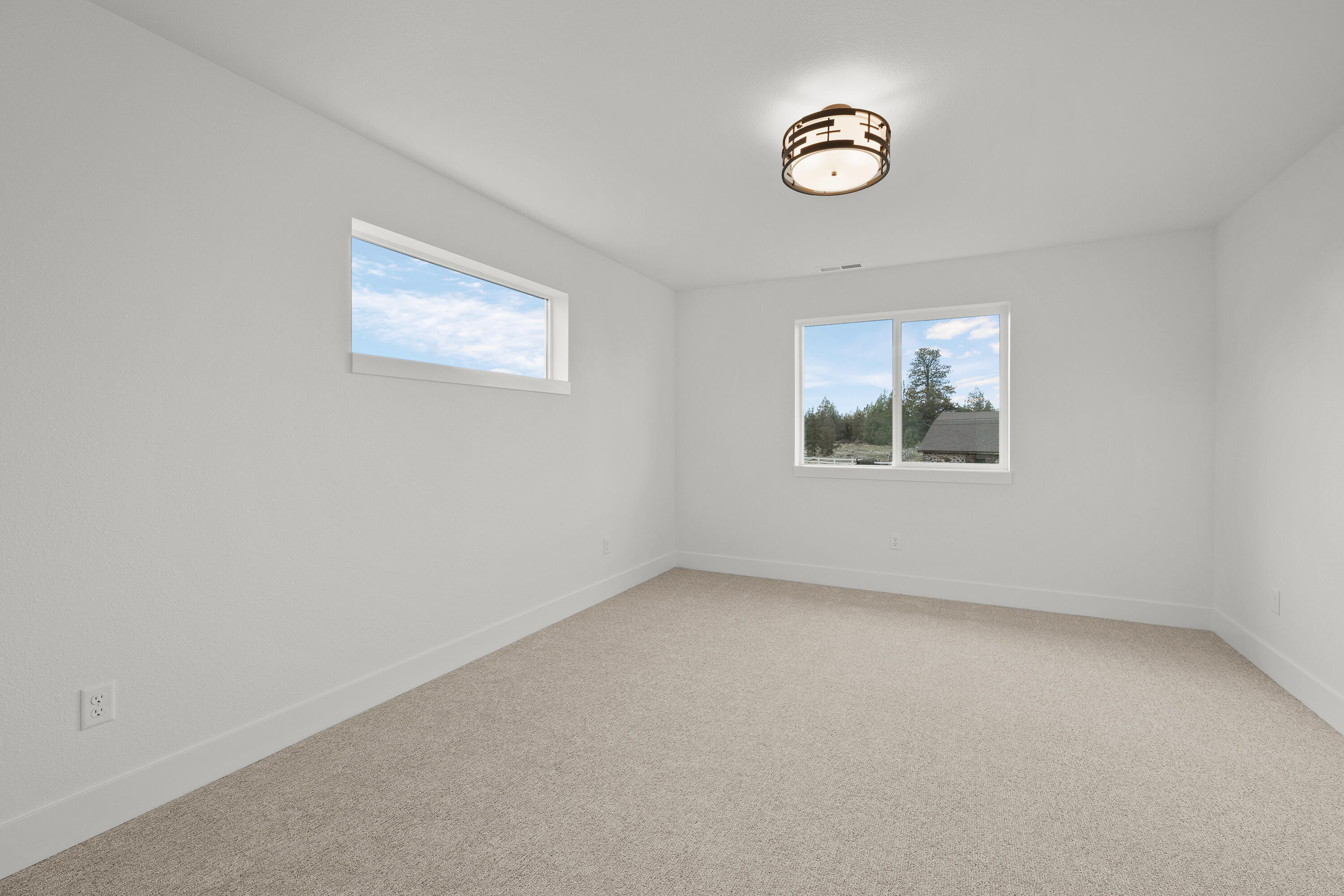 4383 Southwest Rhyolite Place, Unit 22 Redmond, OR 97756 - Photo 35 of 44 an empty room with windows