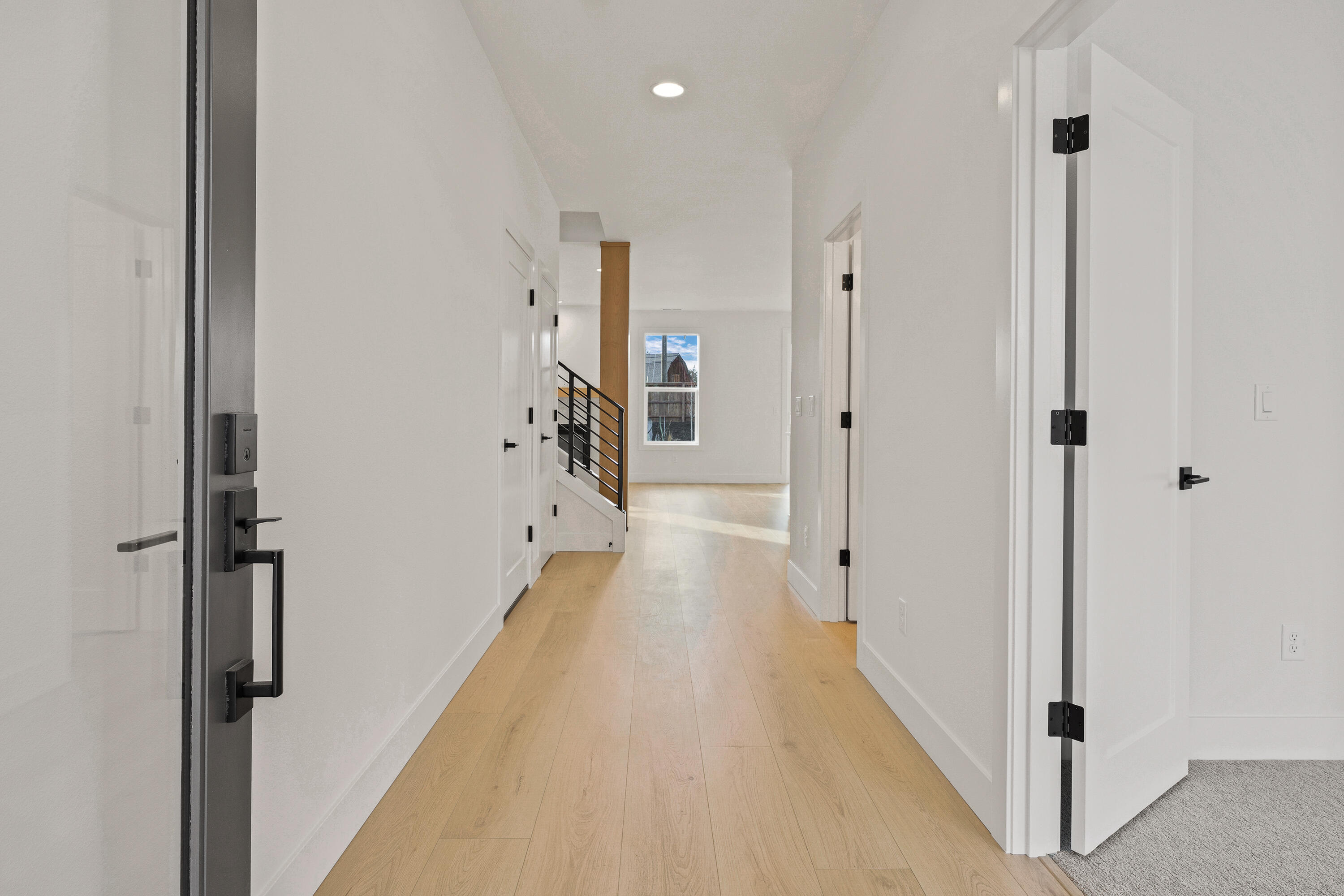 4383 Southwest Rhyolite Place, Unit 22 Redmond, OR 97756 - Photo 4 of 44 a view of a hallway with a white walls