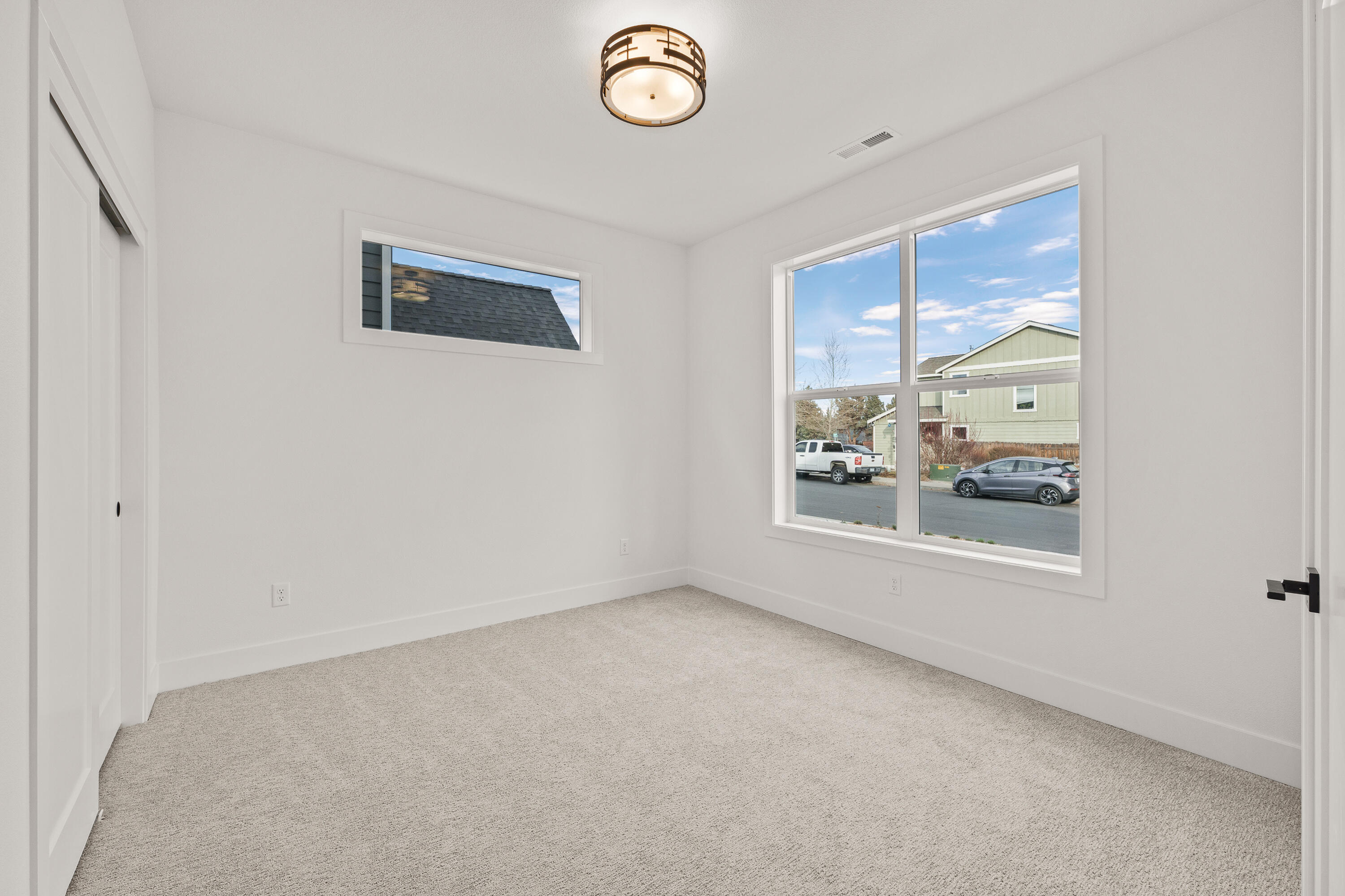 4383 Southwest Rhyolite Place, Unit 22 Redmond, OR 97756 - Photo 6 of 44 a view of an empty room with a window