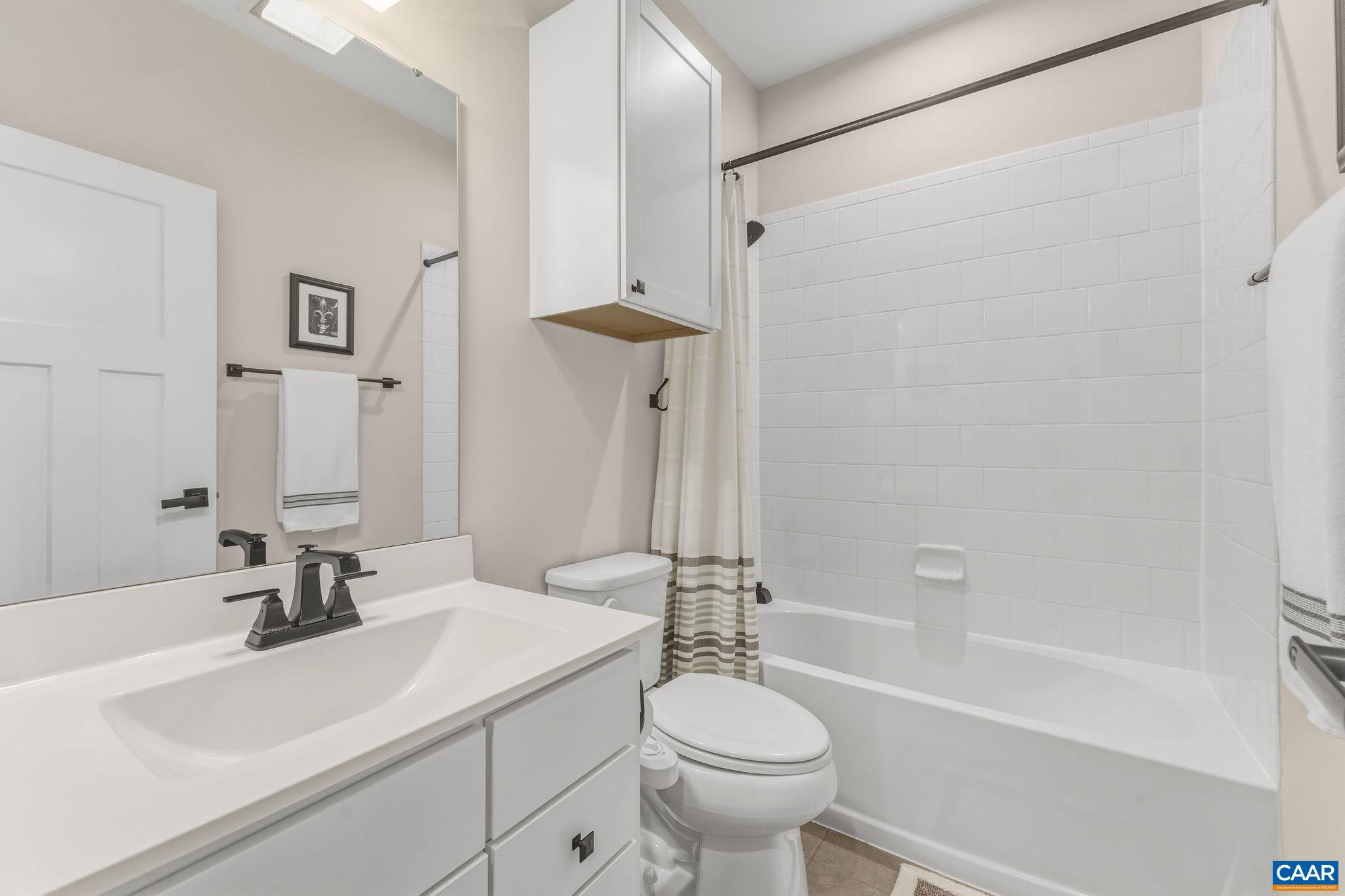 360 Winding Road Keswick, VA 22947 - Photo 34 of 48 a bathroom with a sink a toilet and a bathtub