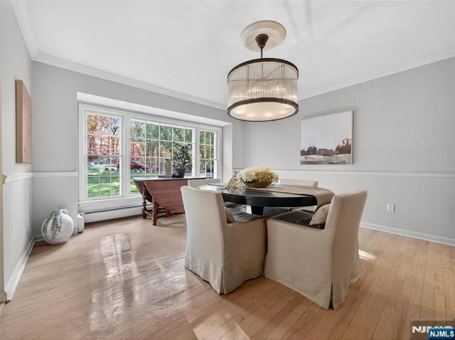 a living room with furniture a window and a table