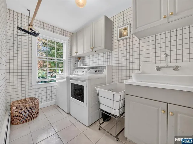 a kitchen with a sink cabinets and window