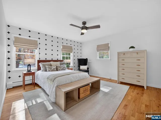 a bedroom with a bed and dresser