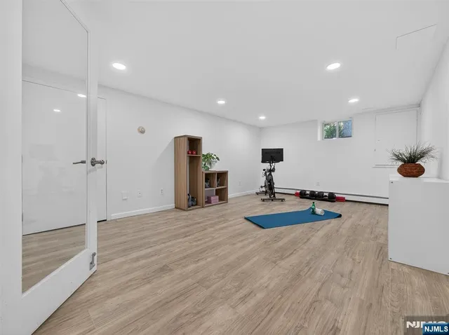 a room with wooden floor and furniture