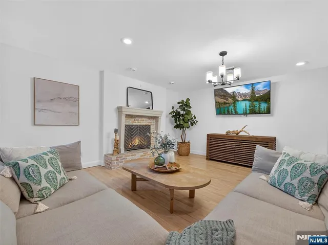a living room with furniture and a fireplace