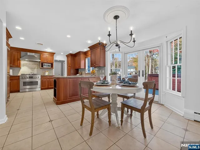 a large kitchen with a table and chairs