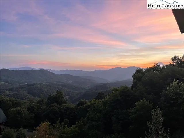 a view of mountains and valleys