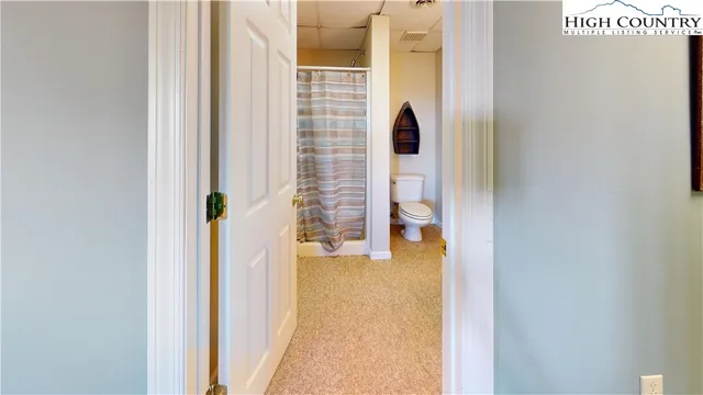 a view of a bedroom from a hallway