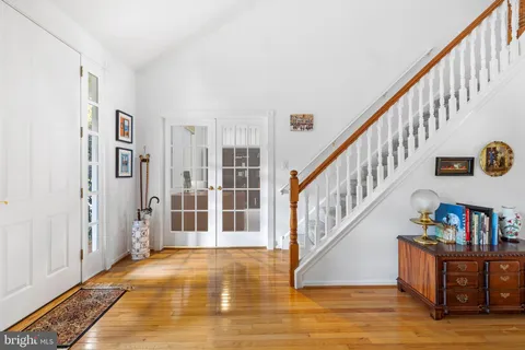 a view of an entryway with wooden floor