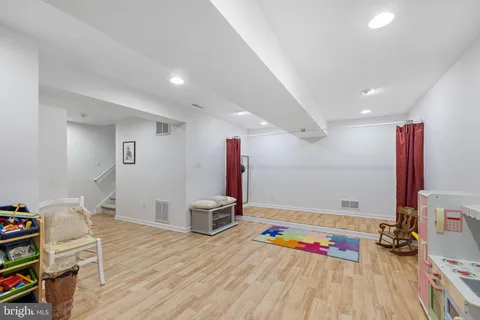 a room with furniture and a wooden floor