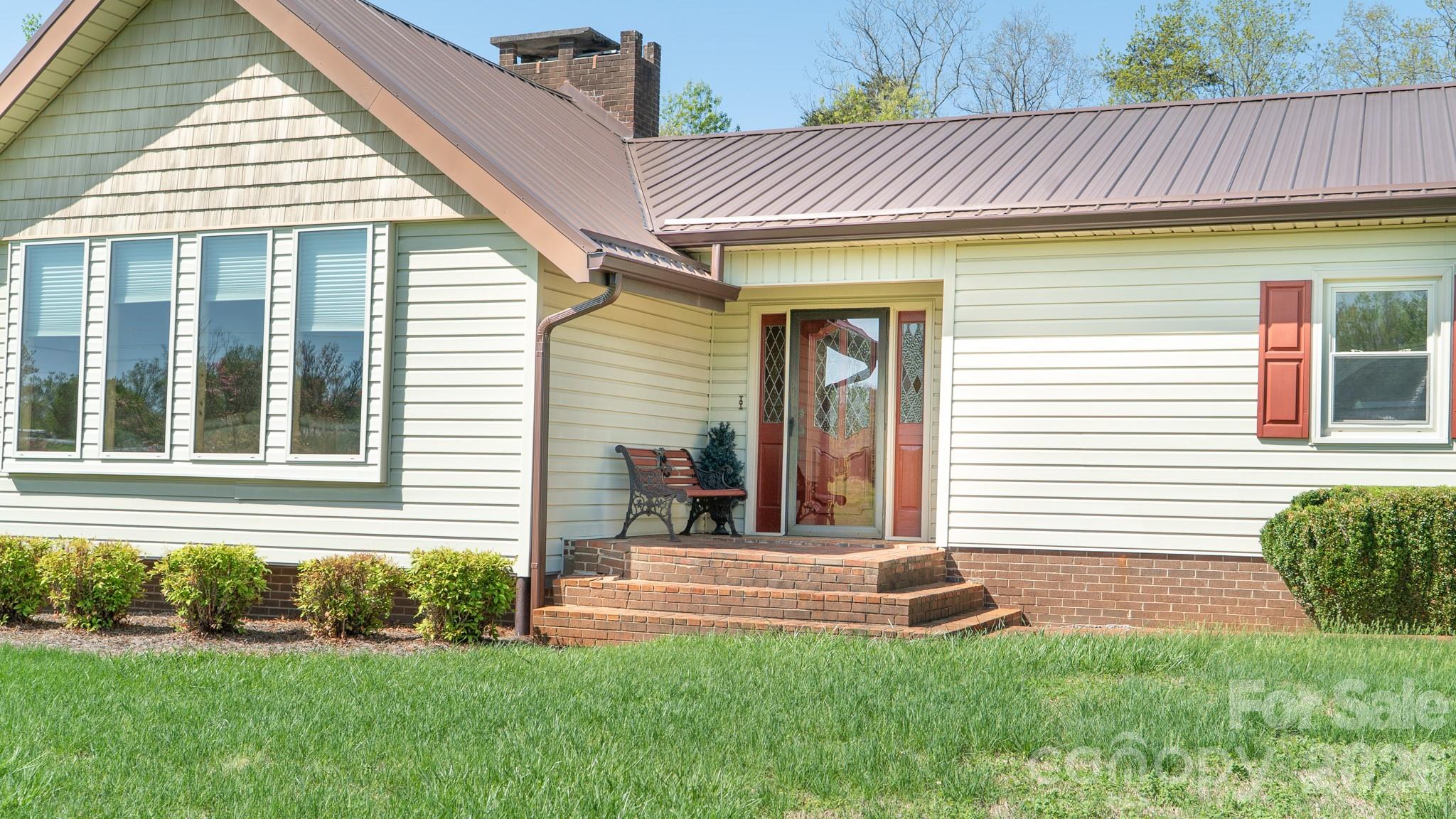1368 Cajah Mountain Road Hudson, NC 28638 - Photo 11 of 46 a front view of a house with a yard
