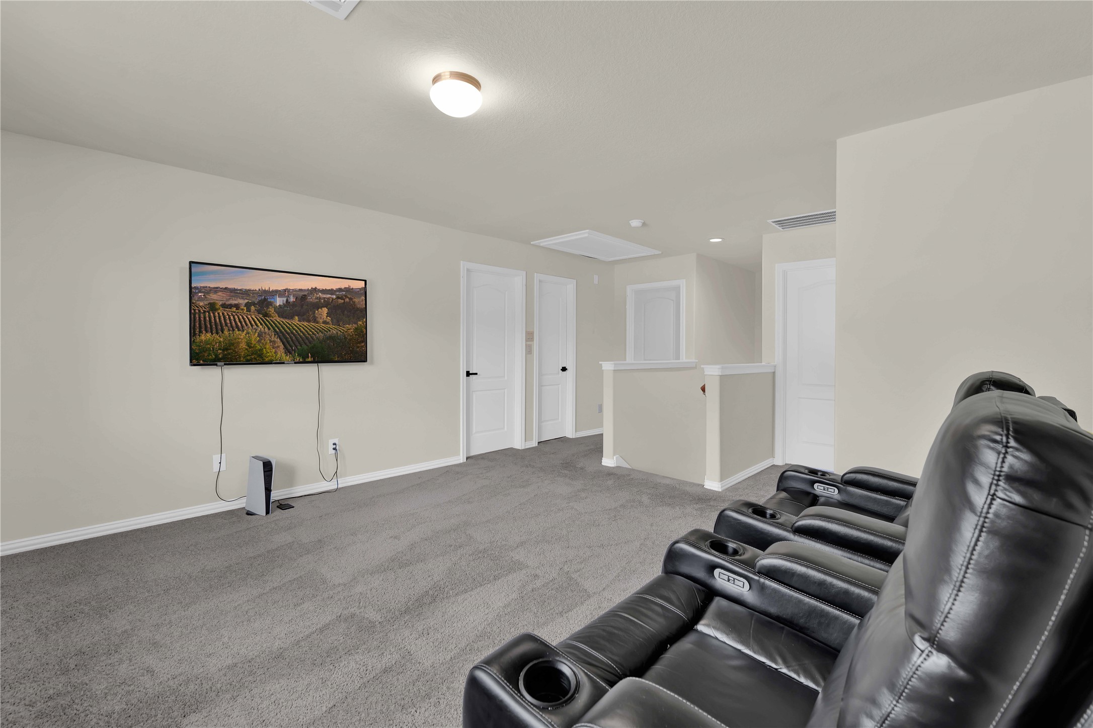 17703 Lion Heart Road Conroe, TX 77306 - Photo 18 of 26 a living room with furniture and a flat screen tv