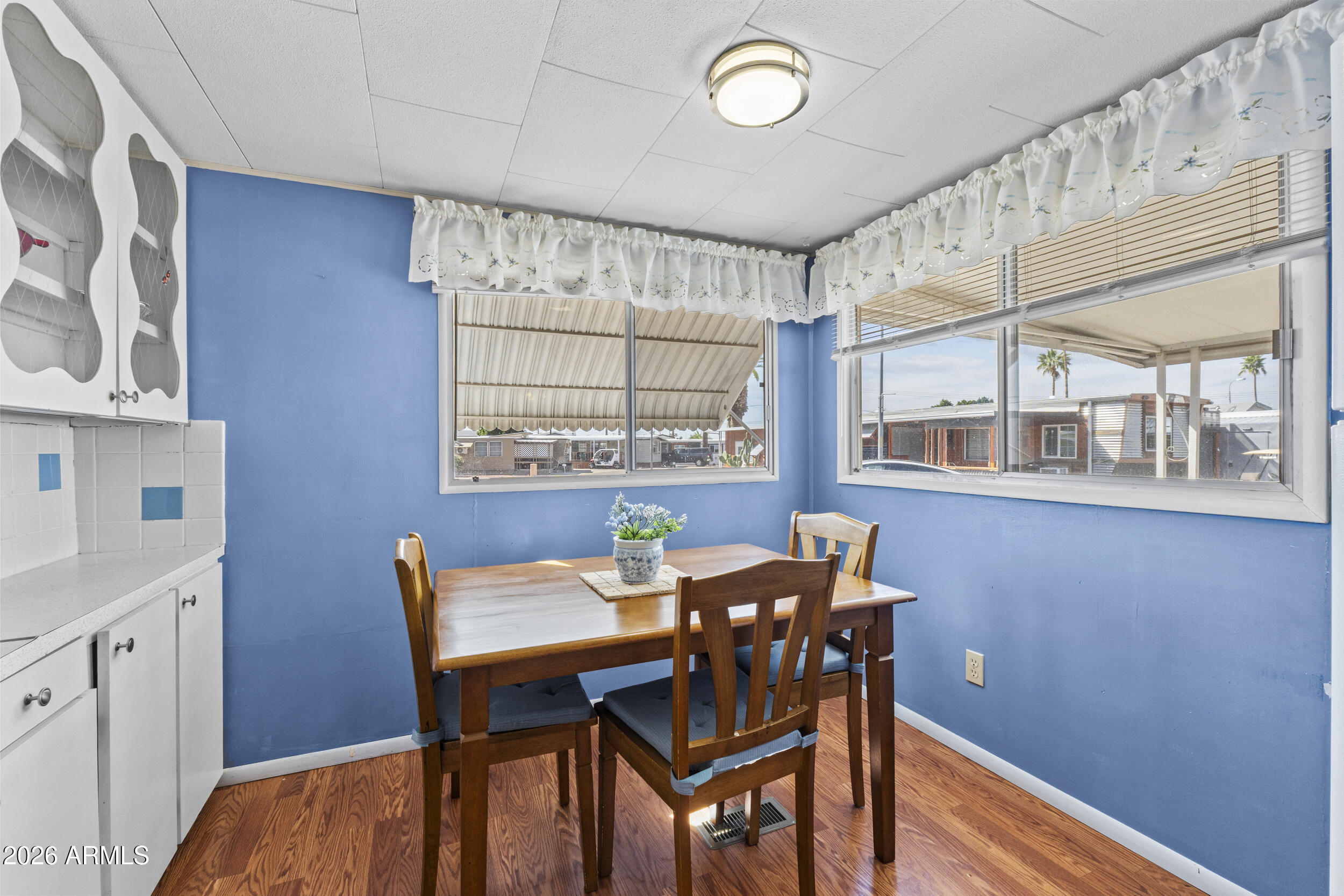 2460 East Main Street, Unit D2 Mesa, AZ 85213 - Photo 12 of 27 a view of a dining room with furniture and window