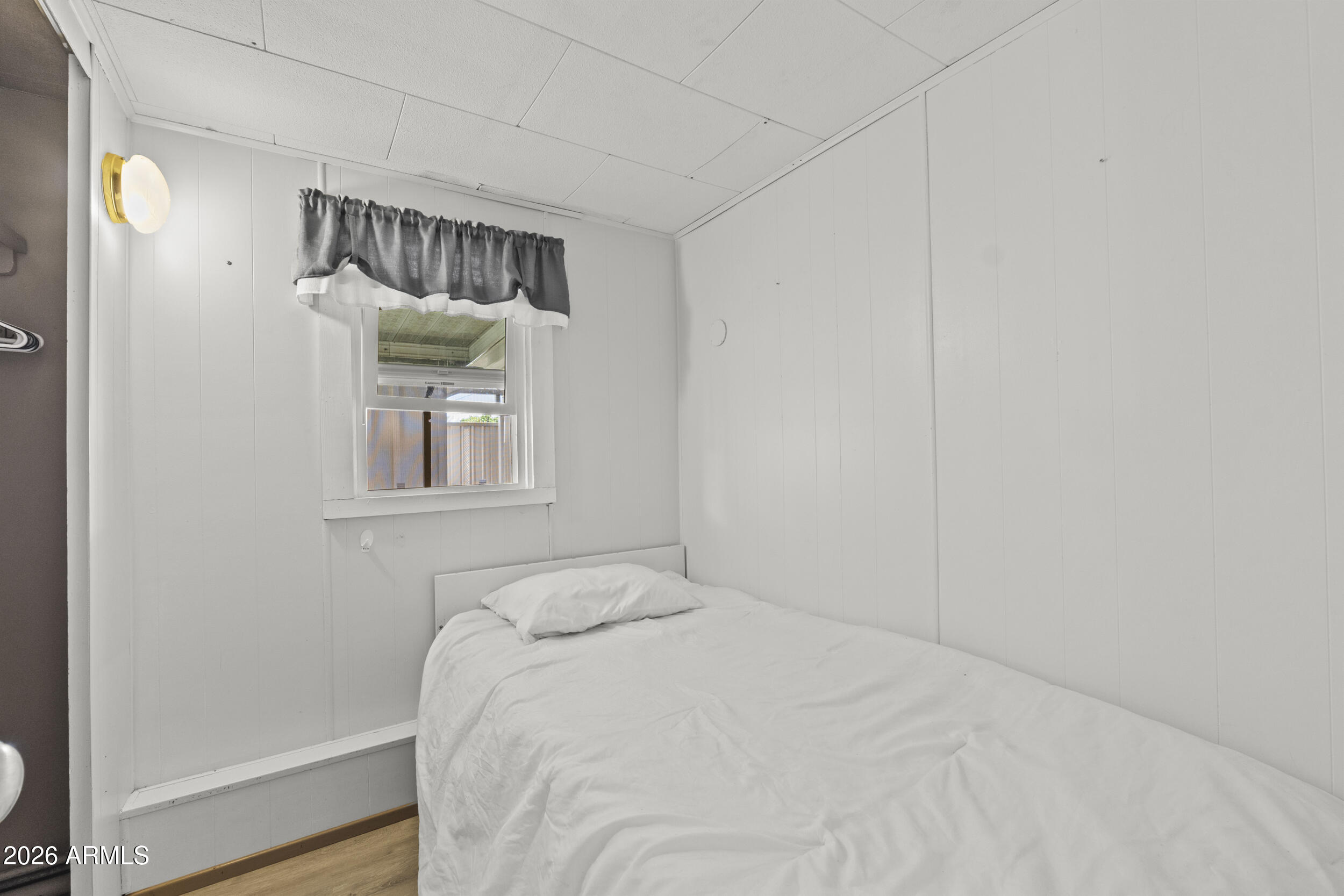 2460 East Main Street, Unit D2 Mesa, AZ 85213 - Photo 17 of 27 a bedroom with a bed and a window