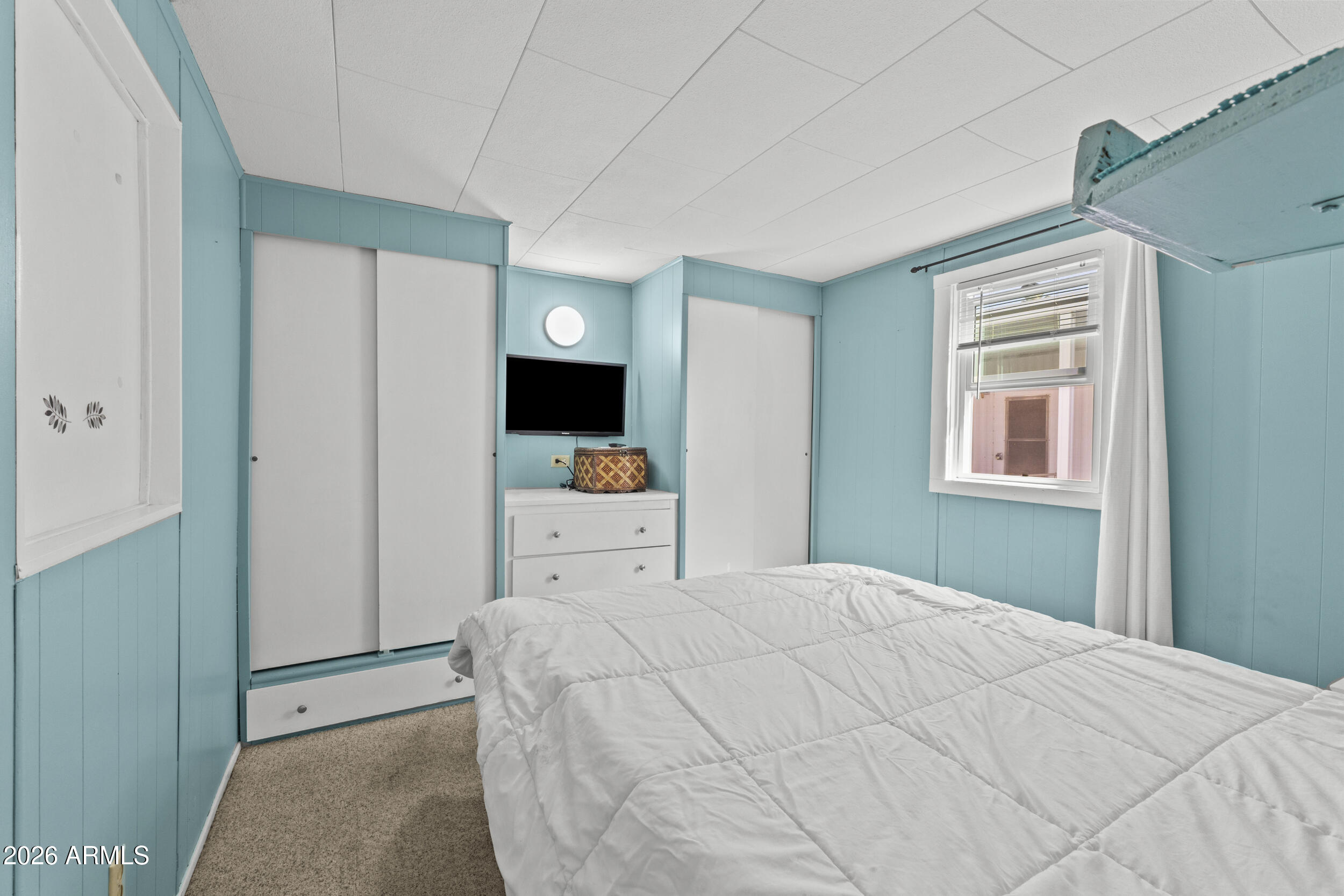 2460 East Main Street, Unit D2 Mesa, AZ 85213 - Photo 18 of 27 a bedroom with a bed and large window