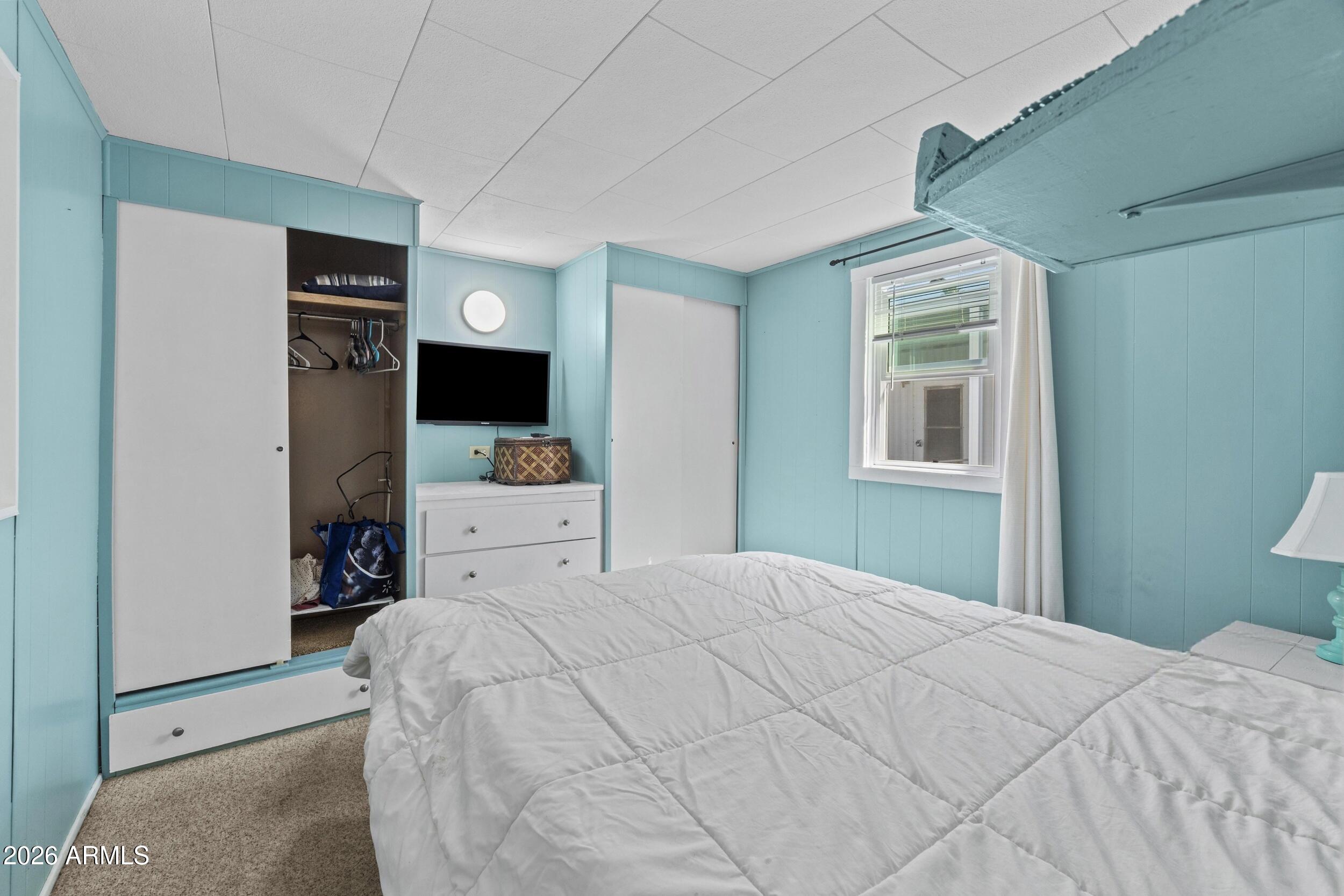 2460 East Main Street, Unit D2 Mesa, AZ 85213 - Photo 19 of 27 a bedroom with a bed bathroom and a window