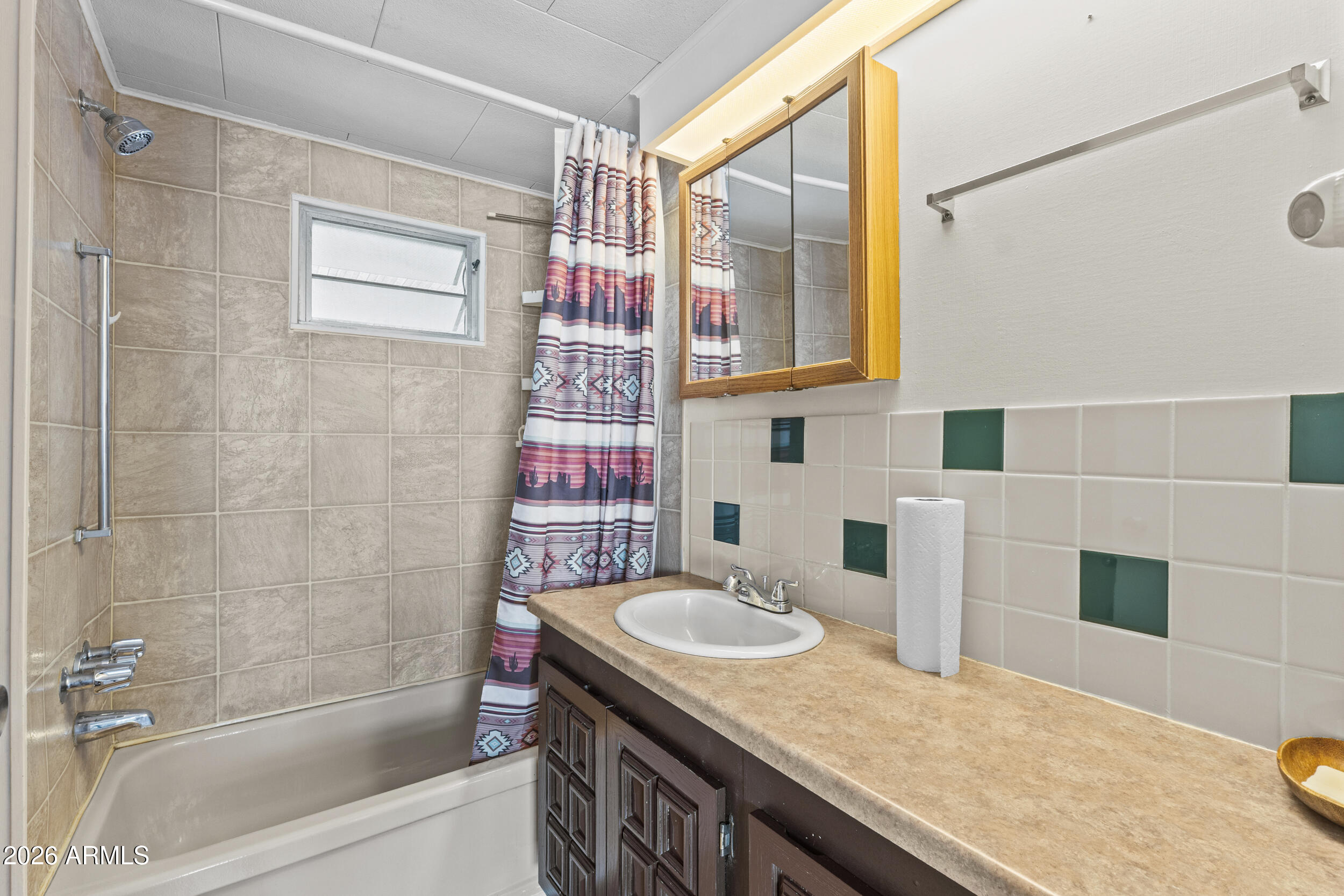 2460 East Main Street, Unit D2 Mesa, AZ 85213 - Photo 21 of 27 a bathroom with a granite countertop sink a mirror and shower