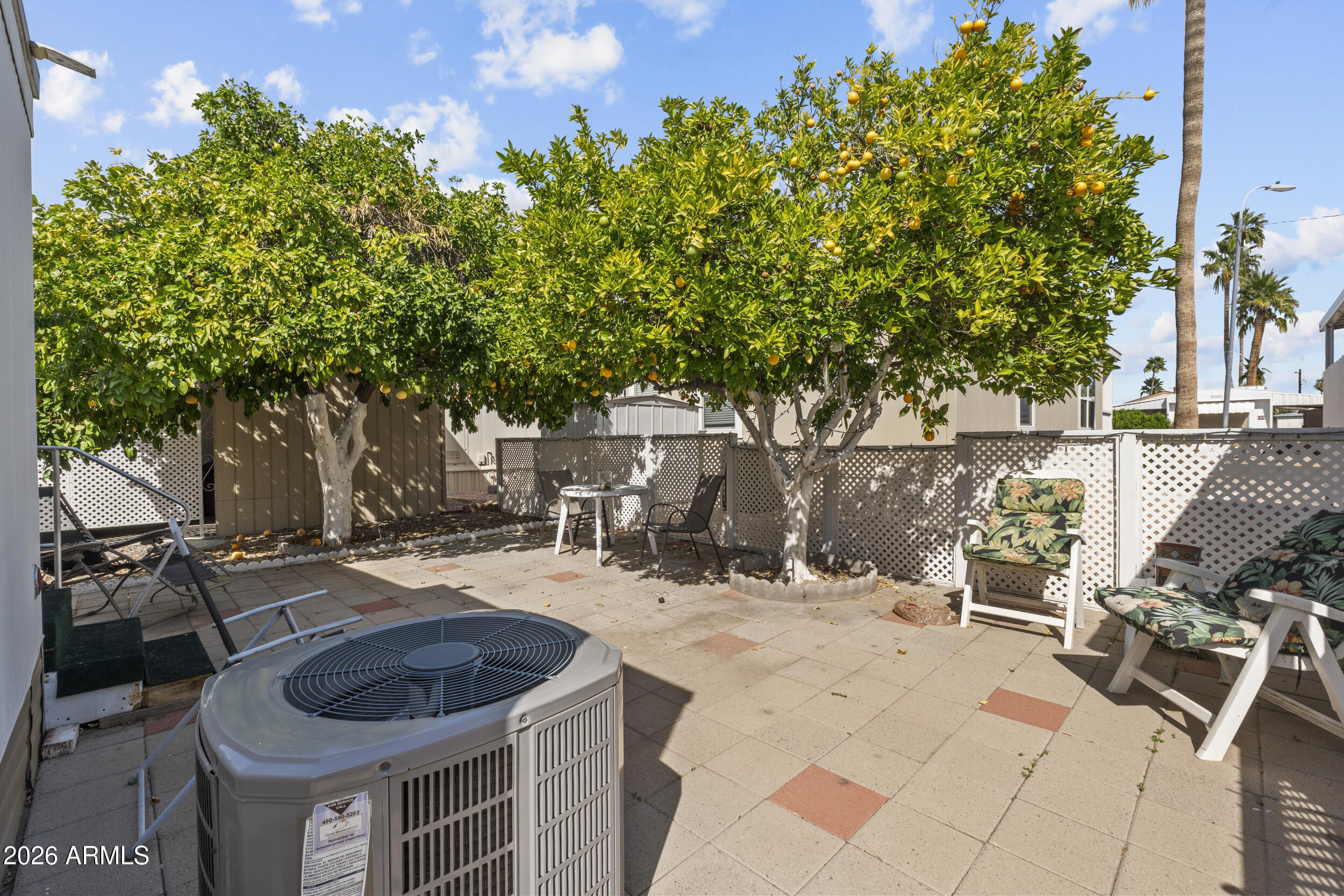 2460 East Main Street, Unit D2 Mesa, AZ 85213 - Photo 24 of 27 a backyard of a house with table and chairs