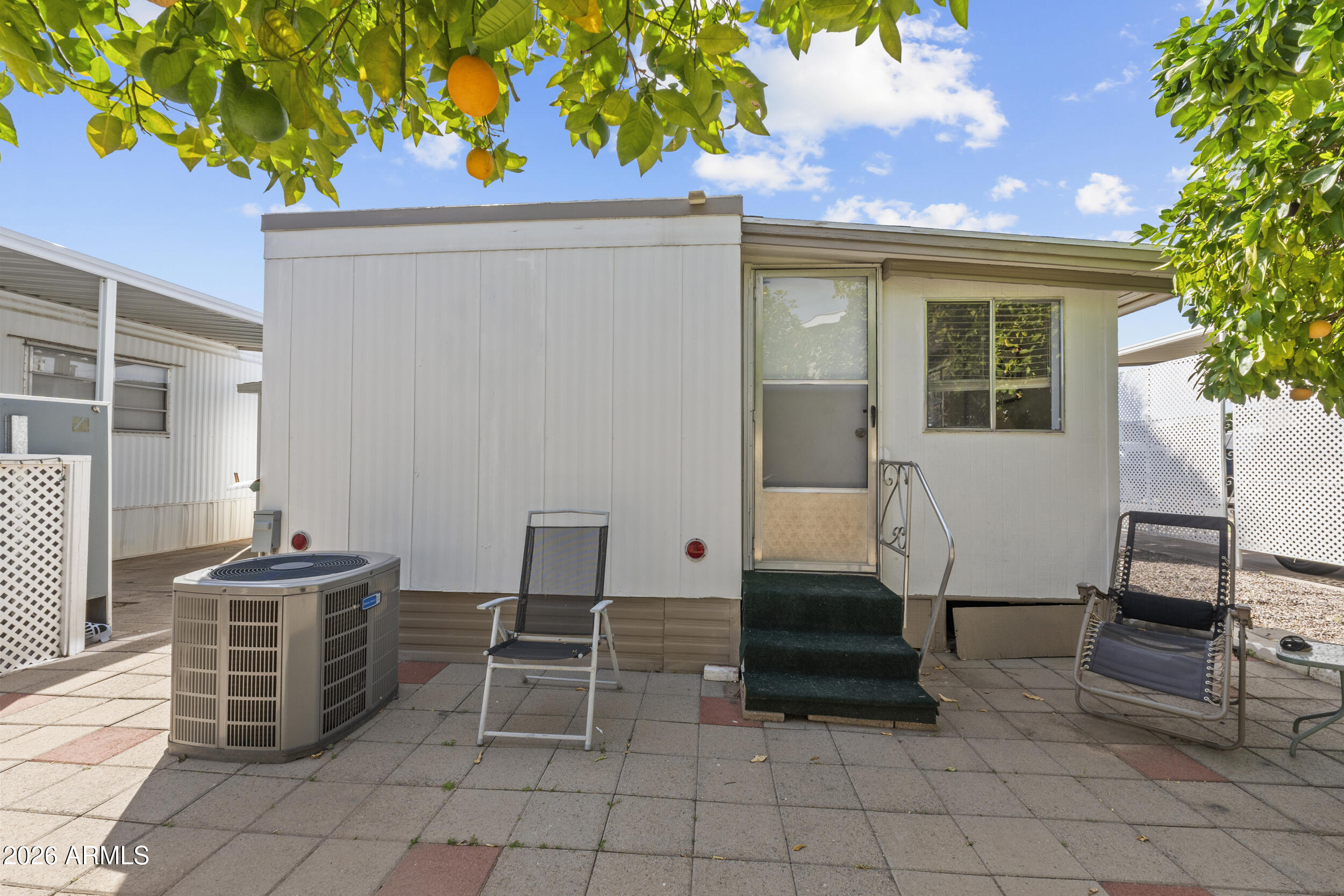 2460 East Main Street, Unit D2 Mesa, AZ 85213 - Photo 25 of 27 a view of a patio with table and chairs and potted plants