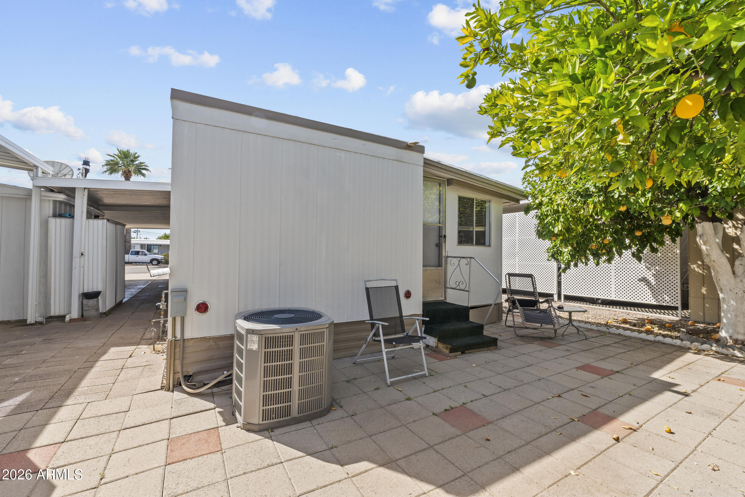 2460 East Main Street, Unit D2 Mesa, AZ 85213 - Photo 26 of 27 a backyard of a house with barbeque oven table and chairs