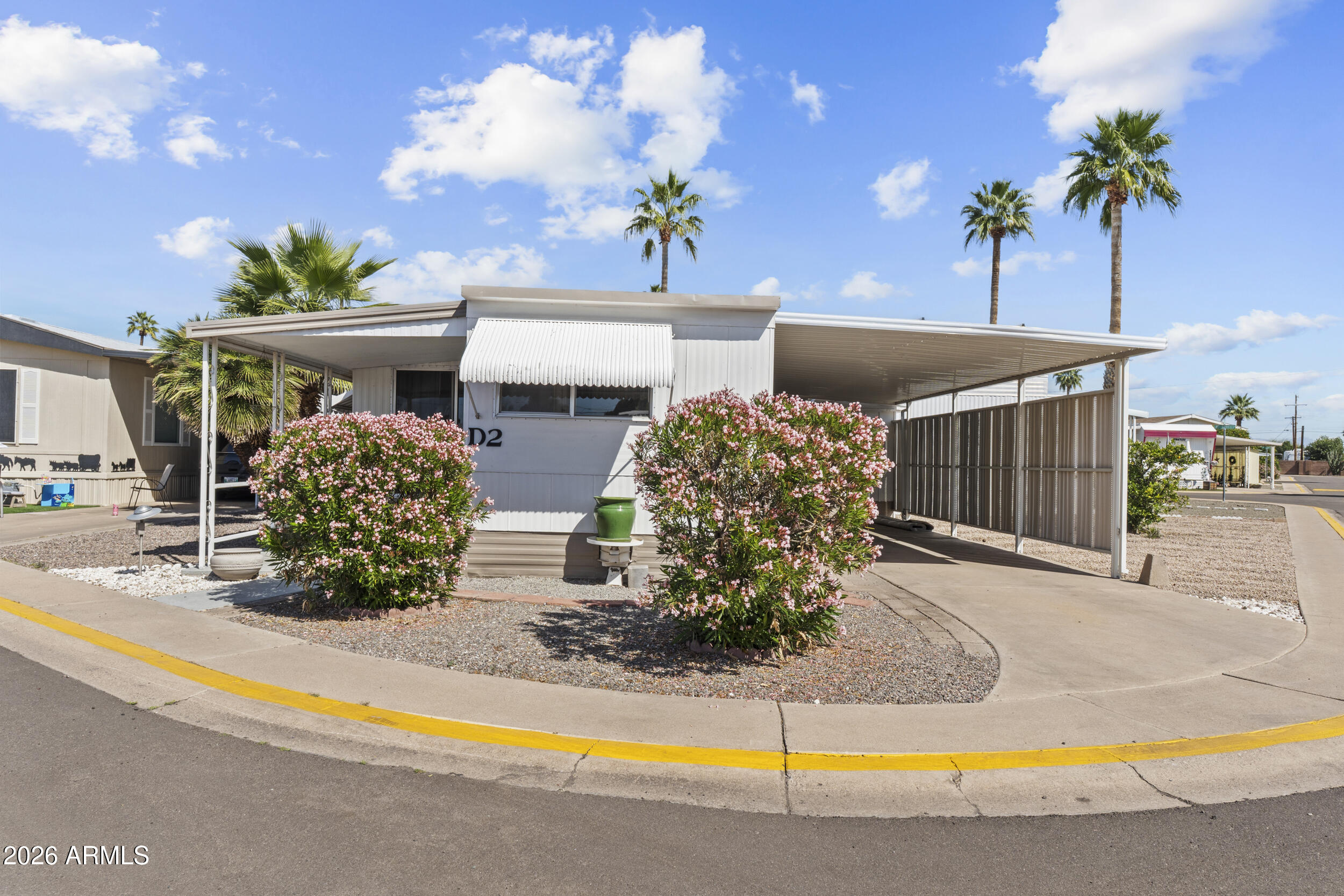2460 East Main Street, Unit D2 Mesa, AZ 85213 - Photo 2 of 27 a view of a house with swimming pool and a yard
