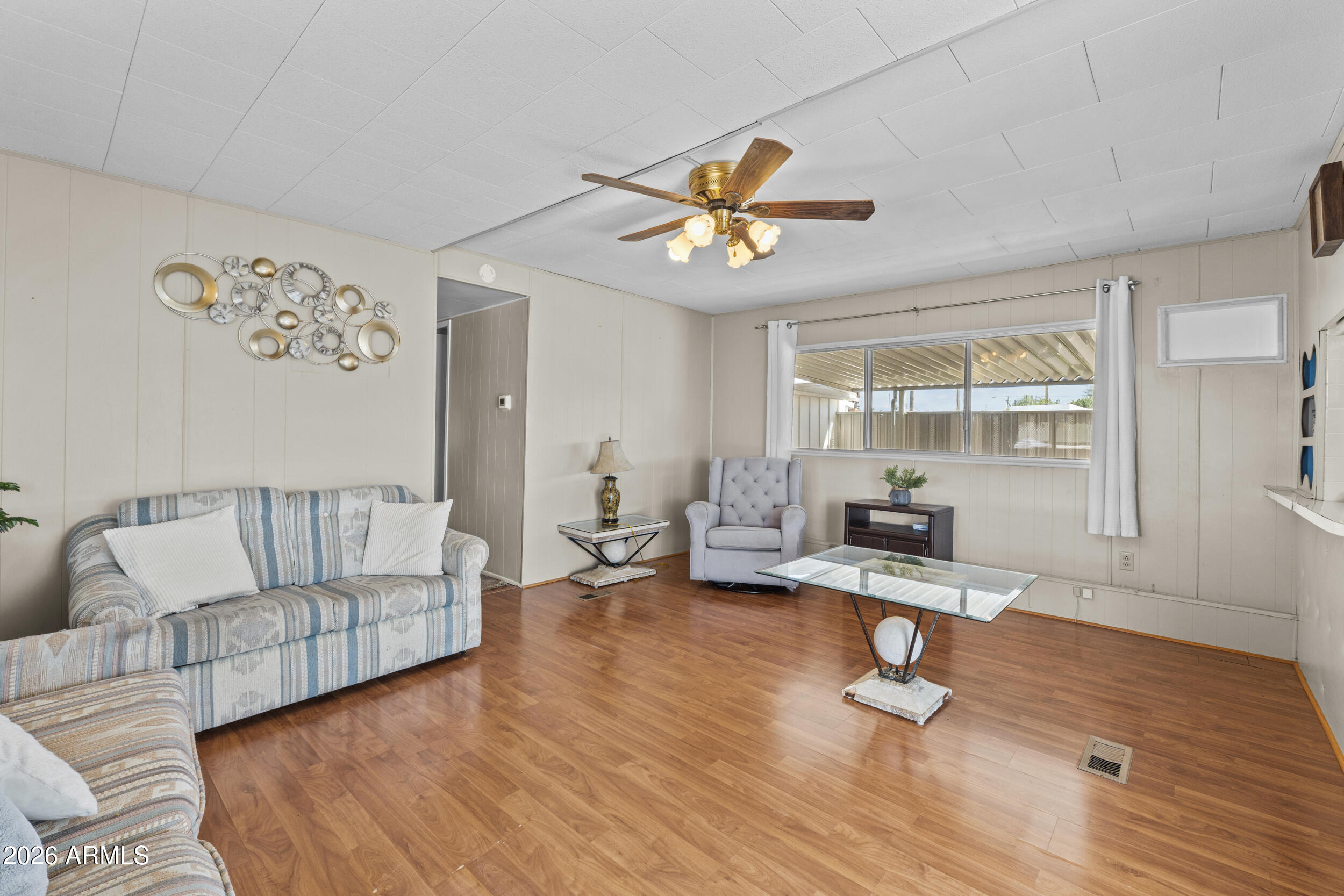 2460 East Main Street, Unit D2 Mesa, AZ 85213 - Photo 6 of 27 a living room with furniture and a wooden floor