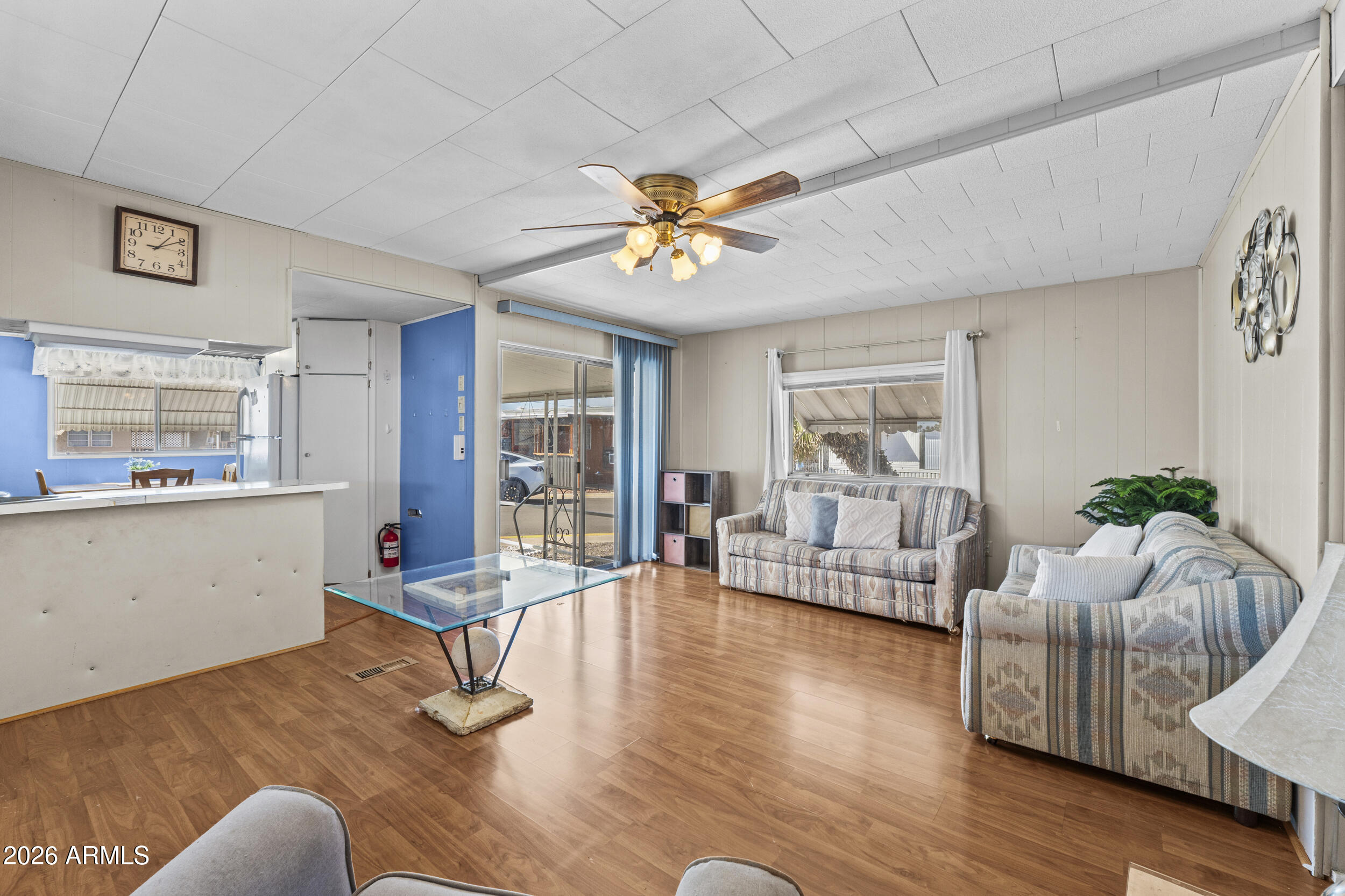 2460 East Main Street, Unit D2 Mesa, AZ 85213 - Photo 8 of 27 a living room with furniture and wooden floor