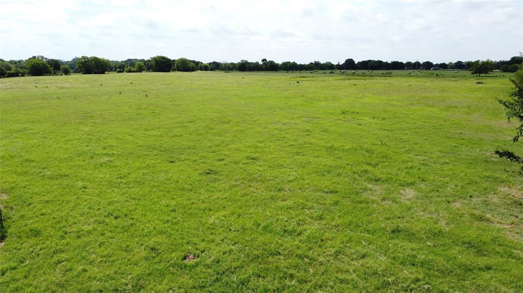 11742 Dane Road Pilot Point, TX 76258 - Photo 16 of 36 a view of a lake with houses in the background