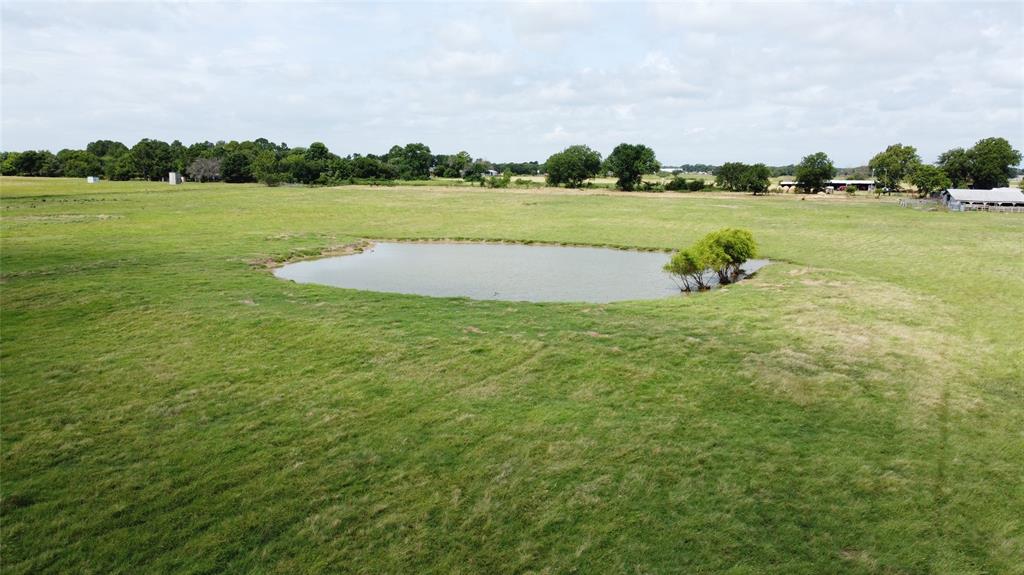 11742 Dane Road Pilot Point, TX 76258 - Photo 28 of 36 a view of a lake and houses in the background