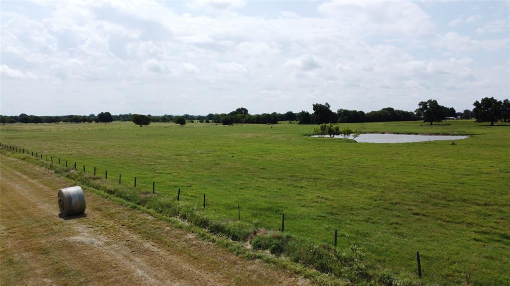 11742 Dane Road Pilot Point, TX 76258 - Photo 33 of 36 a view of a lake with houses in the back