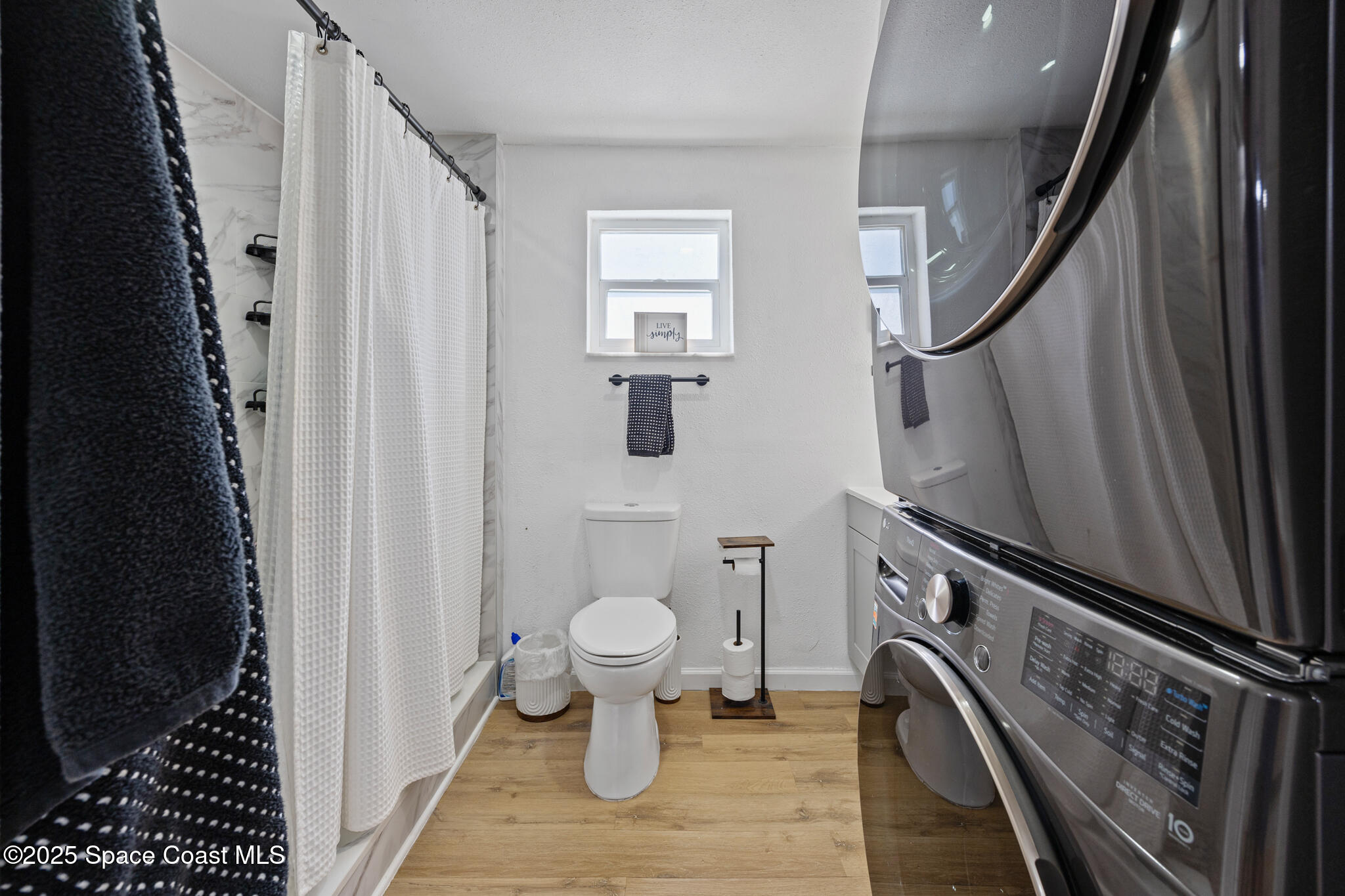 115 Primrose Lane Melbourne, FL 32901 - Photo 12 of 22 a bathroom with a sink toilet and shower