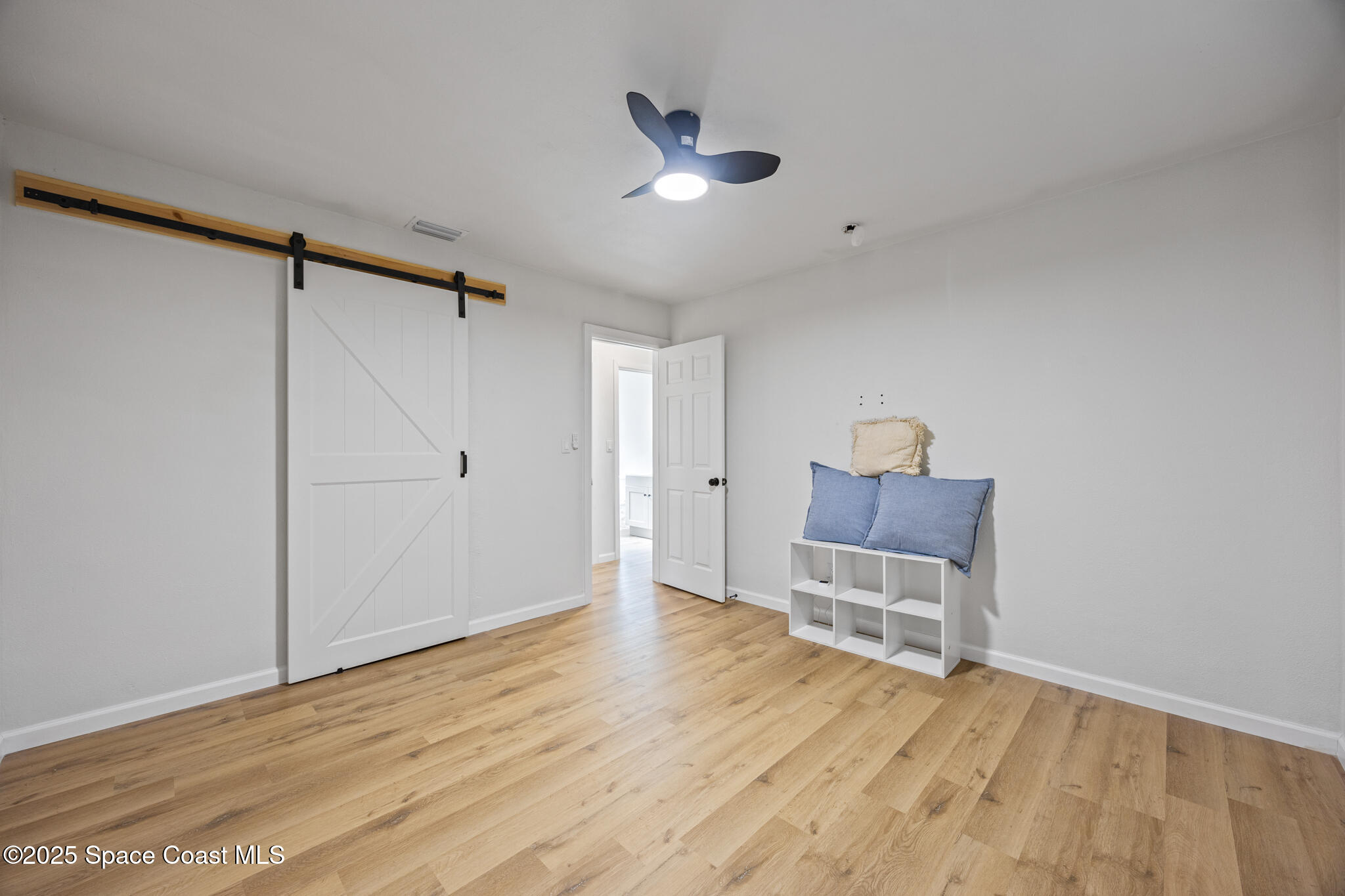 115 Primrose Lane Melbourne, FL 32901 - Photo 21 of 22 a view of empty room with wooden floor