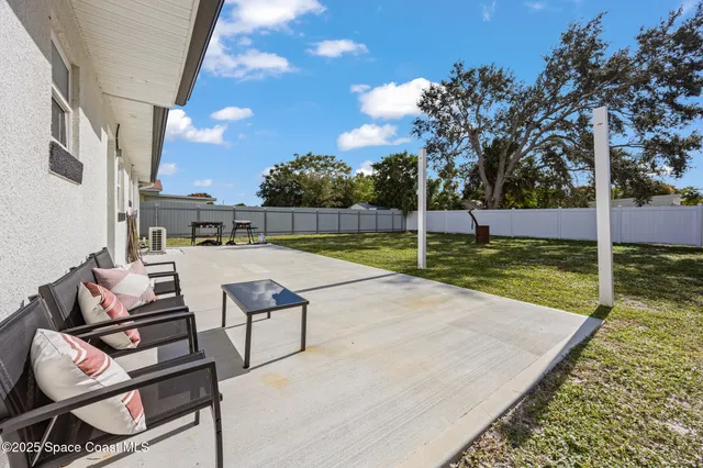 swimming pool view with a outdoor seating