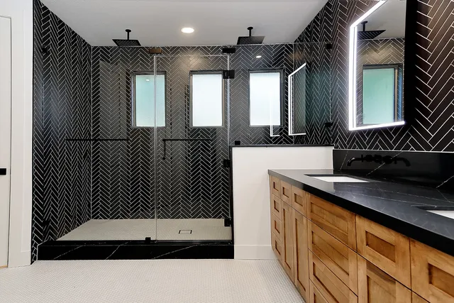 a bathroom with a double vanity sink and mirror